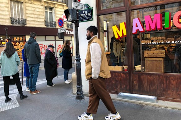 Customers line up outside Mamiche cafe in Paris. 