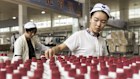 Employees arrange bottles of Moutai baijiu at the Kweichow Moutai Co. factory in the town of Maotai in Renhuai, Guizhou province, China, on Thursday, Dec. 14, 2017. Moutai baijiu's fiery flavor and potential to appreciate in price is driving blistering demand. That in turn has pushed its market value to more than $145 billion, well past?British?whisky?giant?Diageo Plc. Photographer: Qilai Shen/Bloomberg