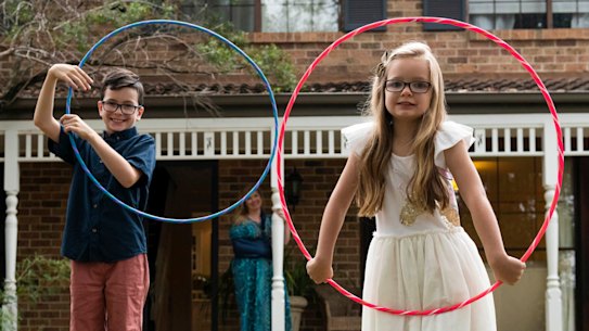 Kate Murray watches her bored kids Xavier and Amelie play.