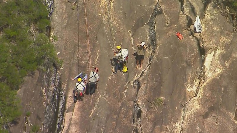 Woman dies, partner fights for life after falling down cliff face