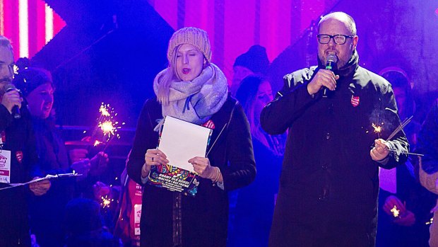 Gdansk Mayor Pawel Adamowicz ,right,  speaks to an audience shortly before he was stabbed.