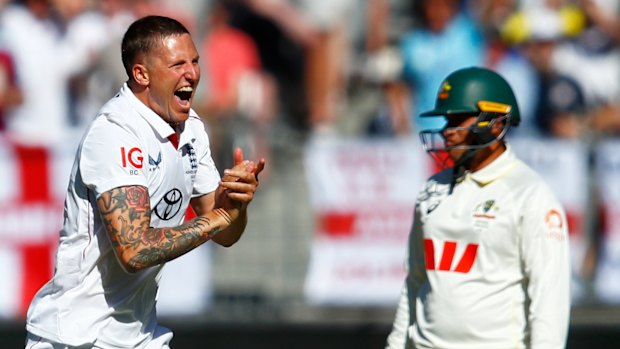 England’s Brydon Carse celebrates the wicket of Australia Usman Khawaja. 