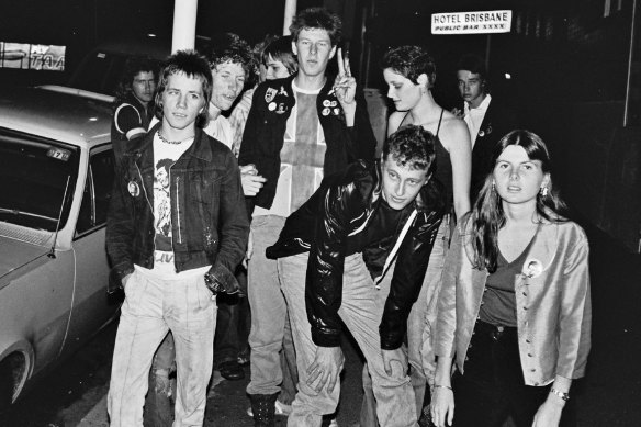 Outside the Hotel Brisbane are Victor Bryce, Bobby Maclot, David “Dodo” Donald, Alan Randall, Tim Simmonds, Gary, an unidentified woman, Brian Battley and Peta Lloyd.