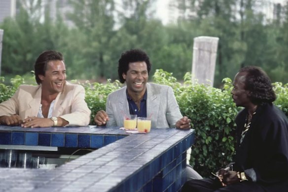 Miles Davis (right) with Don Johnson and Philip Michael Thomas as Sonny Crockett and Rico Tubbs.