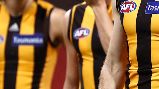 Dejected Hawks players after their loss to Collingwood on Friday night.