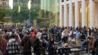 Shoppers wait in line outside the Apple Fifth Avenue store in New York for last week’s launch of the new iPhone. The US consumer has proved particularly resilient.
