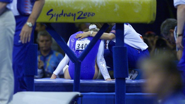 Great Britain's Annika Reeder injures her ankle after falling on the incorrectly set vault.