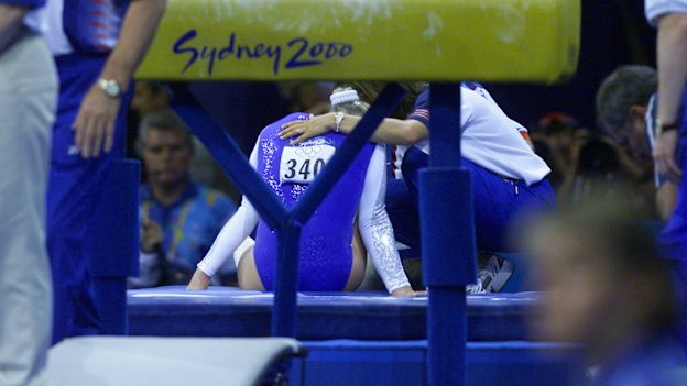 Great Britain's Annika Reeder injures her ankle after falling on the incorrectly set vault.