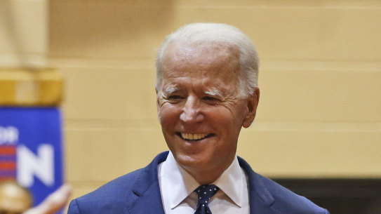 Democratic presidential candidate former Vice President Joe Biden, walks to the stage during a campaign rally Sunday, March 1, 2020, in Norfolk, Va. (AP Photo/Steve Helber)