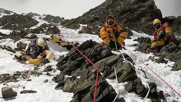 Two sherpas retrieve the body of Indian climber Goutam Ghosh (left) in May 2017. He had died near the summit a year earlier.