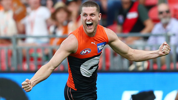 Jacob Hopper celebrates kicking a late goal for the Giants.