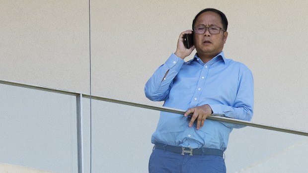 Huang Xiangmo on the balcony of his Mosman home before his permanent residency was cancelled in December.