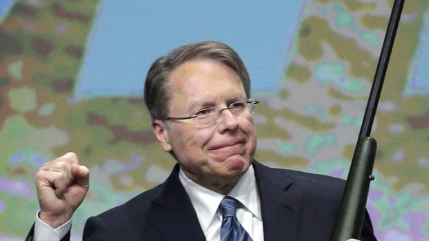 Wayne LaPierre, executive vice-president of the National Rifle Association, holds a custom 300 Remington ultra mag during a gun auction in 2013.