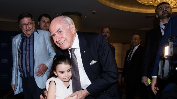 Liberal supporters in the Ballroom of the Sofitel Wentworth, for the Liberal party post election celebration. Photo shows Former Prime Minister John Howard arriving.