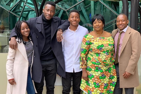 Roza Abebwa (middle right) with family.