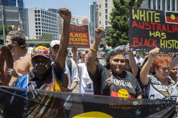 Demonstrators gather to protest the deaths of indigenous Australians in custody.