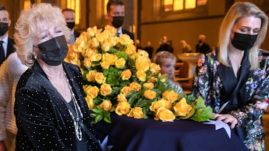 Patti Newton, left, and daughter Lauren lead Bert’s coffin out of St Patrick’s Cathedral at the end of his state funeral on Friday November 12, 2021.
