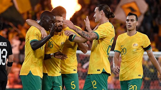 Awer Mabil celebrates his long-range winner with Socceroos teammates.