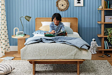 Child sitting in bed
