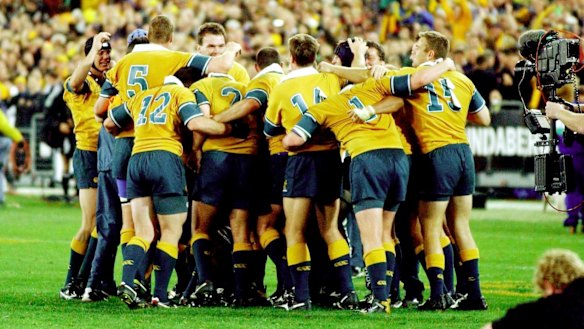 Long time between drinks: The Wallabies huddle together after that 2002 triumph.