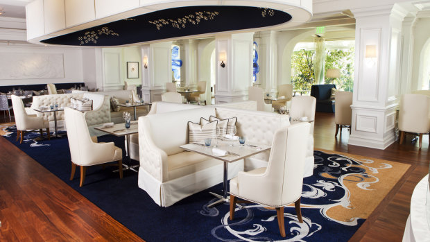 Guests can dine at Royce, where prime cuts are cooked on a wood-fired grill.