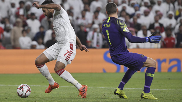 United Arab Emirates' forward Ali Mabkhout dribbles past Australian goalkeeper Mat Ryan to score an easy goal. 