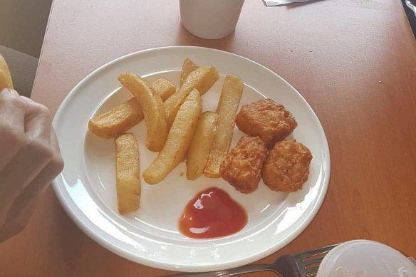 A dinner of chips and chicken nuggets at an aged care home.