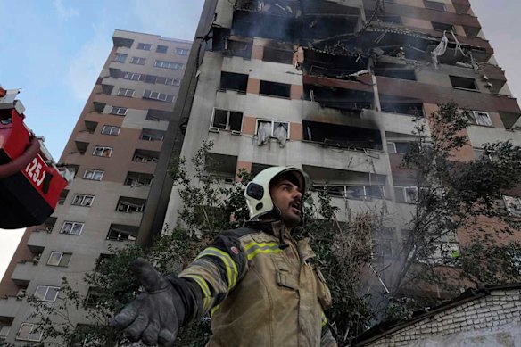 A firefighter at the scene of an explosion in an apartment block in northern Tehran.