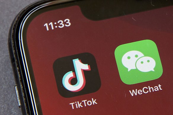 Icons for smartphone apps TikTok and WeChat appear on a smartphone screen in Beijing.