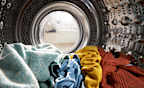 View Looking Out From Inside Washing Machine Filled With Laundry