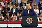 Donald Trump is mocked behind his back by a rally audience member in Georgia.