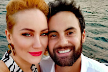 Jules Robinson and Cam Merchant on a boat.