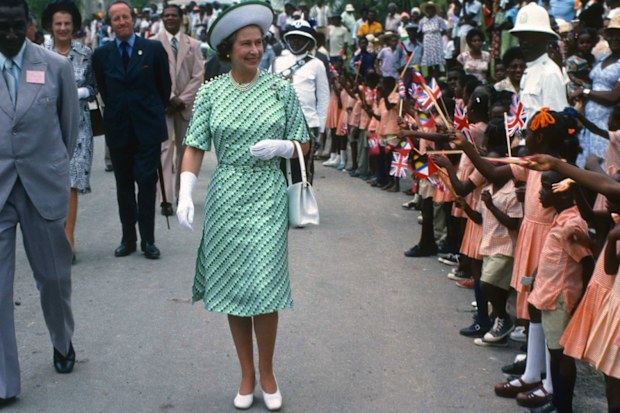 Queen Elizabeth ll is greeted by the public during a walkabout in Barbados in 1977.
