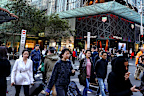 Shoppers walk through Sydney CBD after the Omicron wave lockdown was lifted.