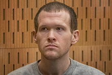 Christchurch mosque gunman Brenton Tarrant listens to victim impact statements during his sentencing hearing at Christchurch High Court.