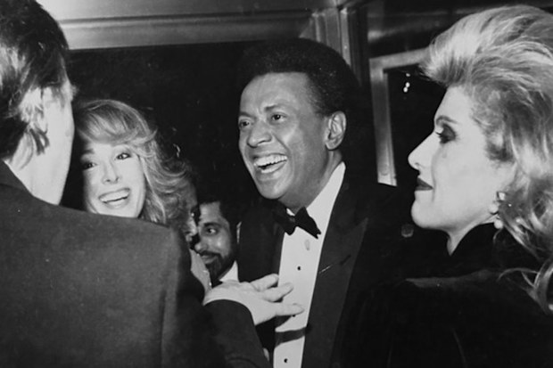 Donald Trump (far left) speaks to E Jean Carroll (second from left) in 1987. This week the president declared he had never met her.