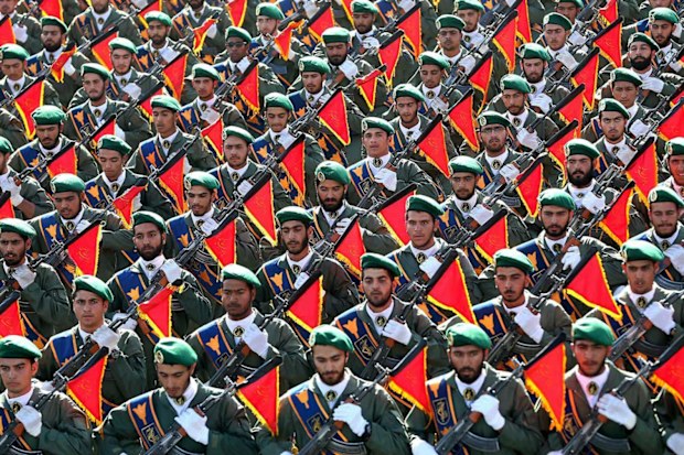 Iran's Revolutionary Guard troops march in a military parade.