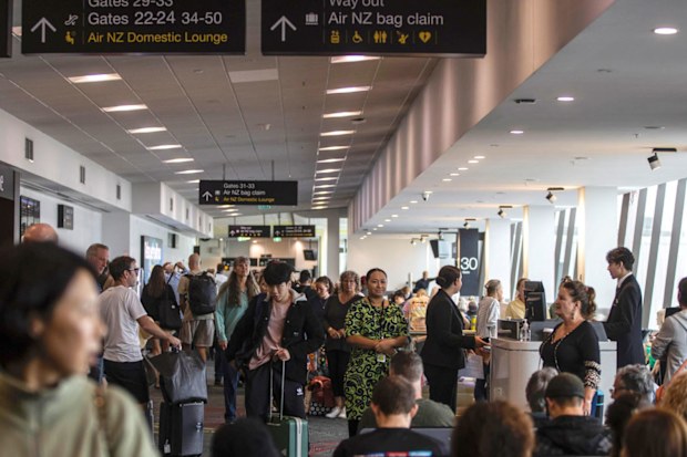 Passengers wait for a flight in Auckland Airport.
