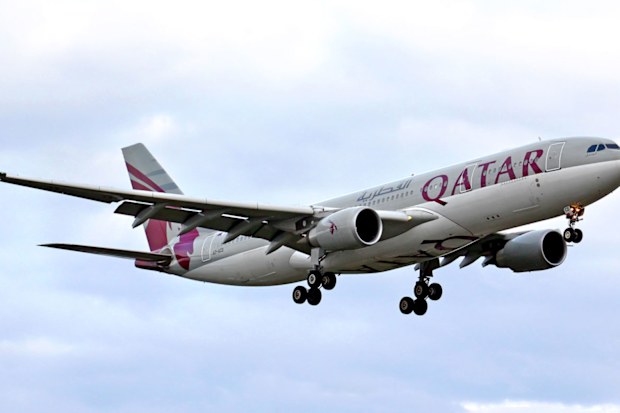 A Qatar Airways plane takes off.