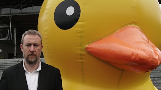 Alex Horne on the set of the show he created, Taskmaster.