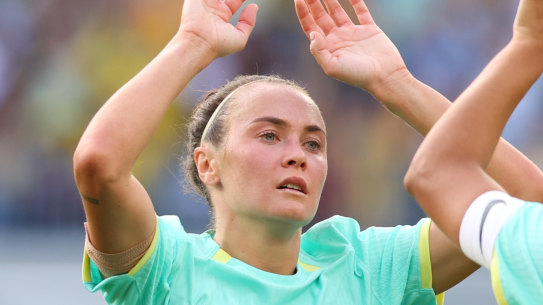 Caitlin Foord high fives Sam Kerr. The pair scored a hat-trick each against the Philippines on Sunday.