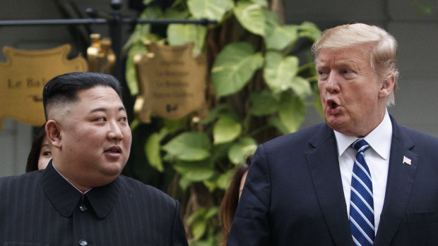 US President Donald Trump and North Korean leader Kim Jong-un take a walk after their first meeting.