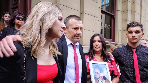 The family of young mother of two, Katie Haley, who was bashed to death with a barbell in her home by partner Shane Robertson, stand outside Melbourne's Supreme Court  after his sentencing on Thursday.