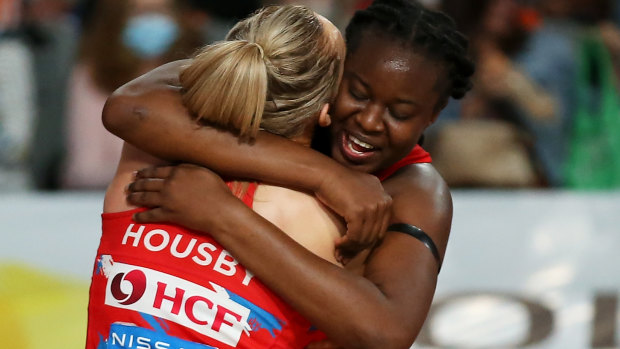 Sam Wallace embraces shooting partner Helen Housby after the Swifts’ semi-final victory over West Coast.