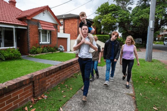 Chris Minns with his family the day after he was elected NSW premier.
