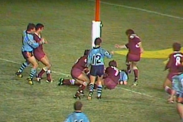 Tommy Raudonikis slips across the try line.
