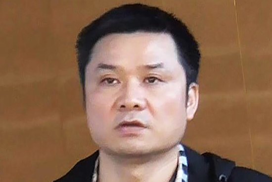 Binjun Xie, who was convicted of charges in Britain but entered Australia and is now linked to organised crime.