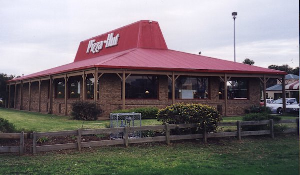 The iconic Pizza Hut red roof, though this example lacks the trapezoid windows.