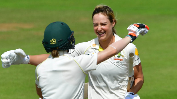 Ton of talent: Australia's Ellyse Perry (right) celebrates her 100 with Racheal Haynes. 