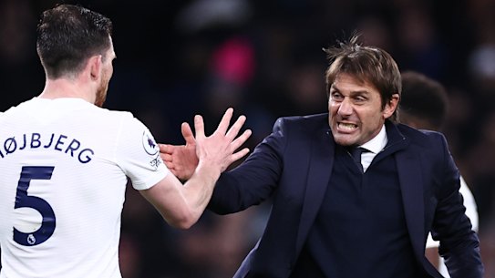 Antonio Conte celebrates victory after his first Premier League game in charge of Tottenham.